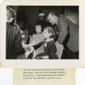 Anita and Jimmy Braden engrossed as their mother, Anne Braden, talks with Willaim Price