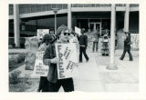 Dennis Brubaher with signs, "Free Robert Arnold / Ronnie Long"