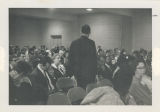 Group seated in folding chairs