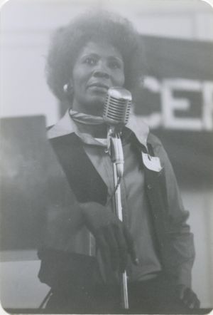 Woman speaking a microphone at SCEF event