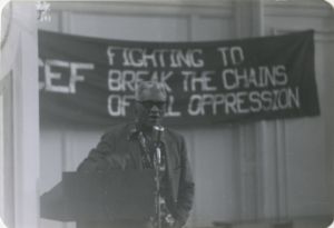 Man speaking at microphone at SCEF event