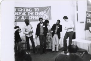 Group on stage, laughing