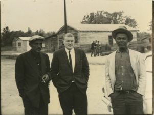 Three men at a farm