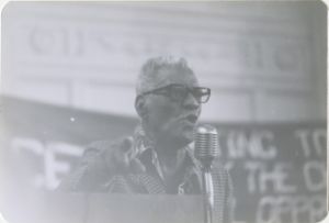 Man speaking at microphone at SCEF event