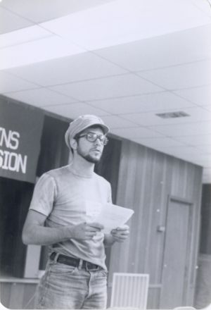Man speaks from notes