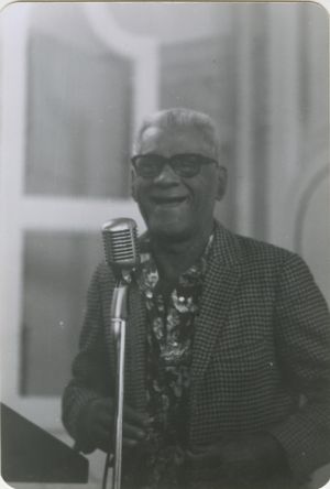 Man speaking at microphone at SCEF event