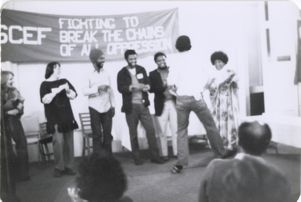 Group on stage talking