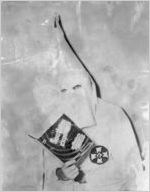 Ku Klux Klansman reading Stetson Kennedy's book Southern Exposure