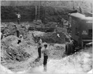 Segregated water buckets among construction workers, Washington D.C., June 7, 1941