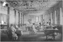 Warehouse of white female employees, some working on handicrafts and most looking at camera, Key West, Florida, July 15, 1936