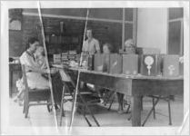 Female WPA workers repairing books, Palm Beach, Florida, July 24, 1936