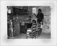 African American mother teaching children, Transylvania, Louisiana, January 1939