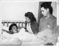 Young zoot suiter in hospital after shooting, Los Angeles, California, June 10, 1943