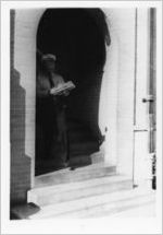 Security guard carrying a newspaper