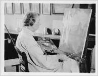 Mrs. Emma Wilson, worker on federal art project, at work on painting, Pensacola, Florida, June 4, 1936