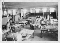 Artisans creating plaster mural scenes