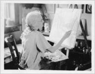 Mrs. Fannie Sweeting, worker on federal art project, at work on painting, Pensacola, Florida, June 4, 1936