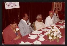[Rosa Parks sitting at a table with two men and two women, possibly at a banquet event] [graphic].
