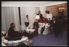 [Rosa Parks with singers Ricky Bell, Michael Bivins, Ronnie DeVoe, assistant Mark Kerrin and others during event at the Watergate Hotel, Washington, D.C.] [graphic].