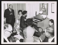 Oliver Lagrone standing, Dr. Ethelene Crockett at piano-organ? [graphic].