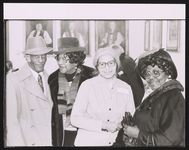 [Rosa Parks, possibly at a church event with three other guests] [graphic].