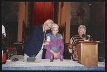 [Mamie Till-Mobley speaking at a church event with Rosa Parks and journalist Vernon Jarrett] [graphic].
