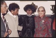 Rosa Parks, actress Cicely Tyson, Rev. Joseph Lowery and an unidentified woman at the reception for the unveiling of Rosa Parks' bust sculpture, National Portrait Gallery, Washington, D.C., 1991] [graphic].