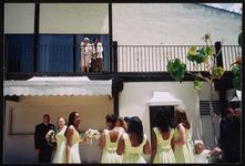 [Rosa Parks and Elaine Steele viewing wedding party from balcony, California] [graphic].