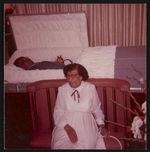 [Woman sitting in front of a coffin, possibly at funeral services for William Arbury] [graphic].