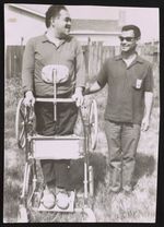Bil standing up in his new walk-alone, given him by veterans hosp., with American Mexican Gilberto Mendoza, 1969 [graphic].