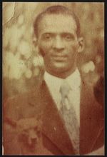Leslie Collins, Sr. with dog [graphic].