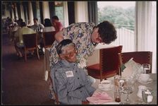[Everee McCauley Ward wearing corsage and sitting at a dining table] [graphic].