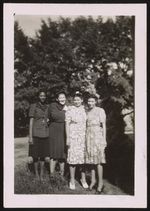 [Four women, posing outdoors] [graphic] /