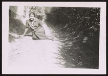 [Portrait of a woman sitting on the ground] [graphic] /