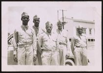 [Sylvester McCauley (fourth from left) and four other soldiers, standing in front of a car] [graphic] /