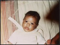 [Baby propped up for photograph] [graphic].
