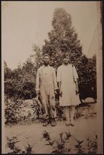 [Full length portrait of an unidentified man and woman, standing side by side on dirt road] [graphic].