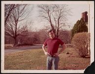 [Unidentified man, hands on hips, standing in yard] [graphic].