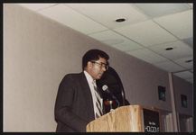 [William McCauley speaking from podium, possibly during a family reunion] [graphic].