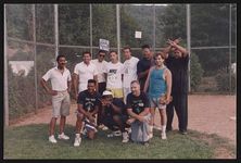 [Cousins and friends pose for photograph on baseball field at McCauley-Dickerson family reunion] [graphic].