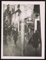 [City scene with pedestrians] [graphic].