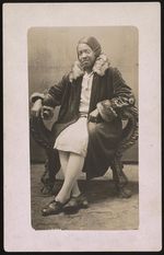 [Gladys Dowdell, wearing fur collared coat, full-length studio portrait, seated, facing front] [graphic].