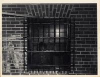 Woman looking out of jail window