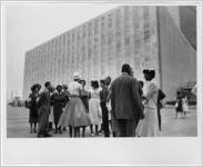 [Talking outside the UN Headquarters, New York, NY, 1958]