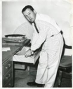 Unidentified man searching through desk