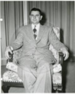 Carroll Gartin seated in chair