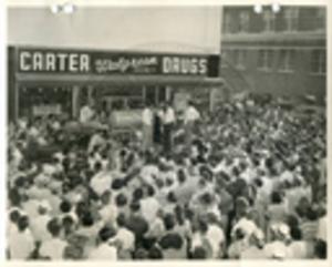 Carroll Gartin speaking in front of Carter Drugs