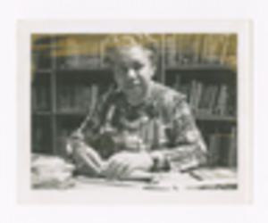 Photograph of Augusta Baker at Desk