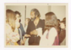 Blurry Photograph of People Conversing at an Event