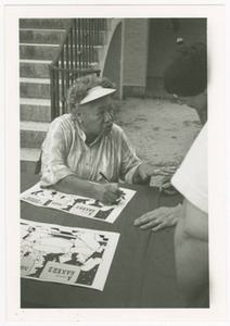 Photograph, Augusta Baker Conversing at Event